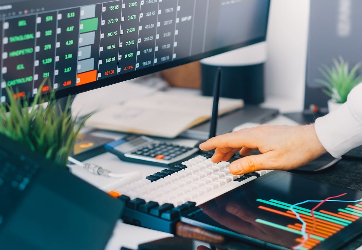 Analytics workstation with live data visualizations on screen